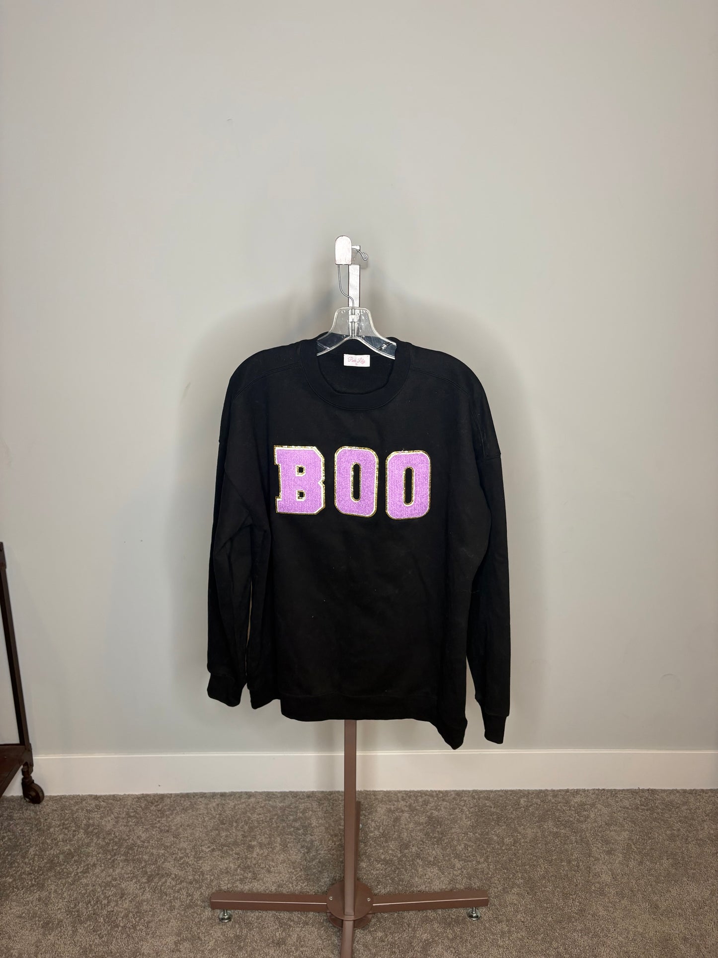 black "BOO" sweater