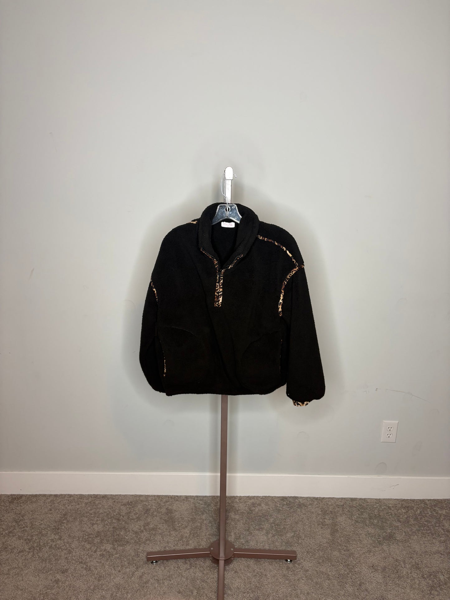 black sweater qaurter zip with cheetah print outline