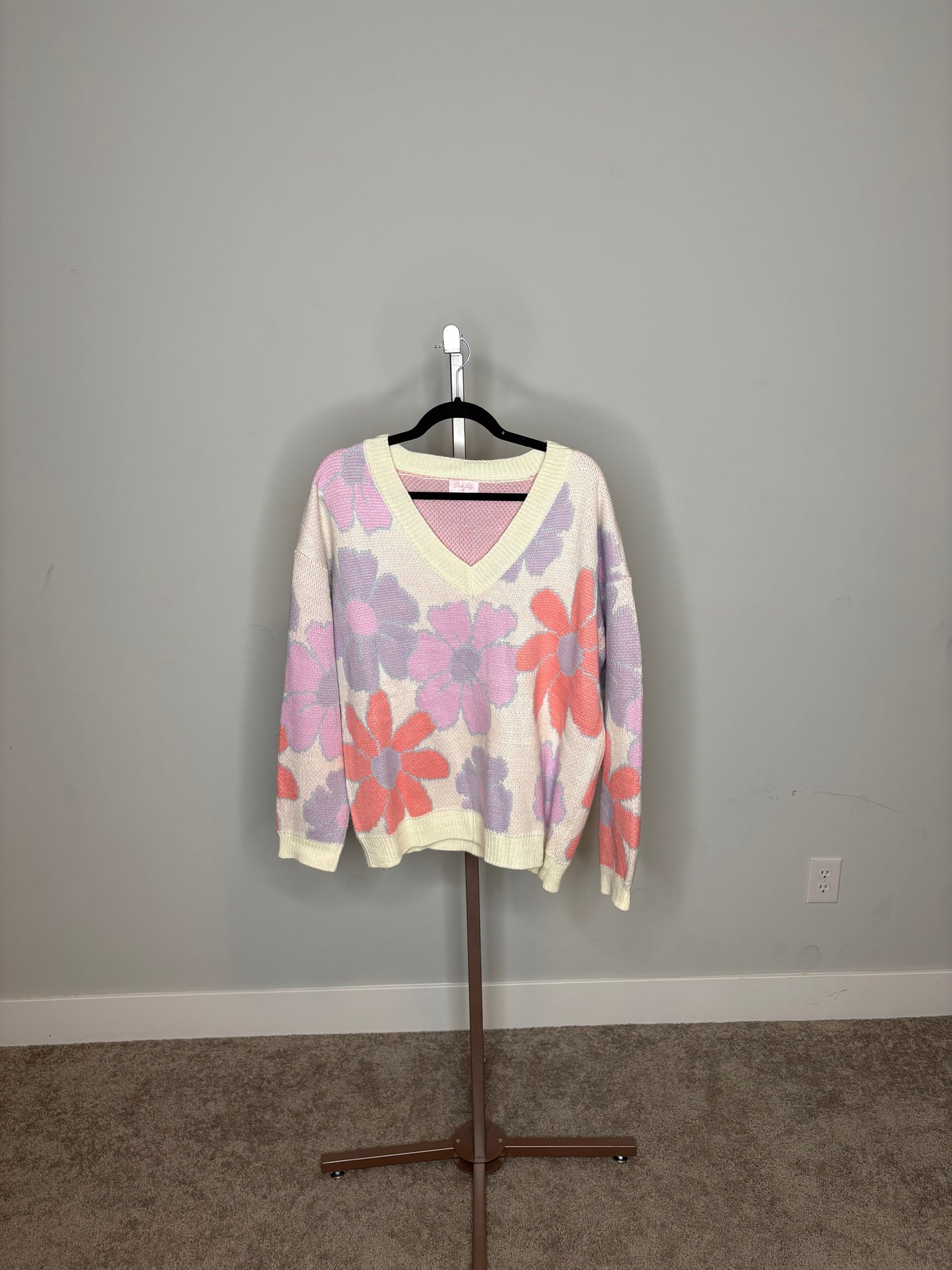 white sweater with purple pink and orange flowers