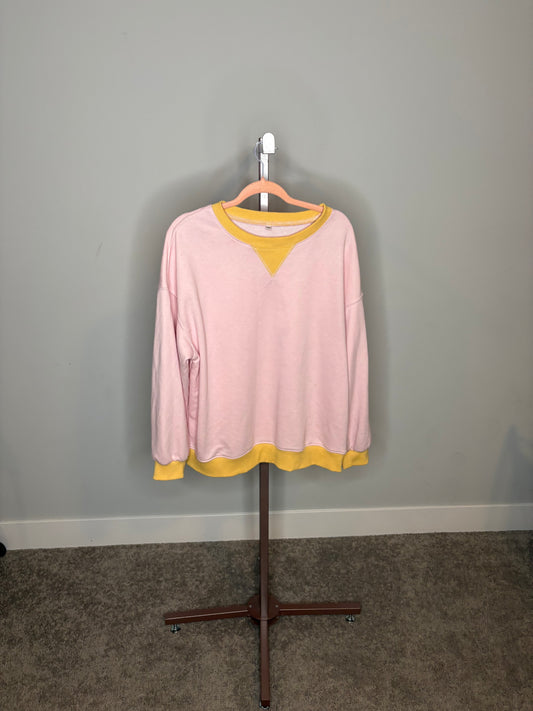 pink sweater with yellow accents