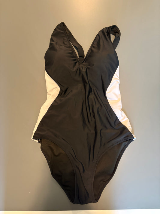slenderizing black one piece bathing suit with white accents