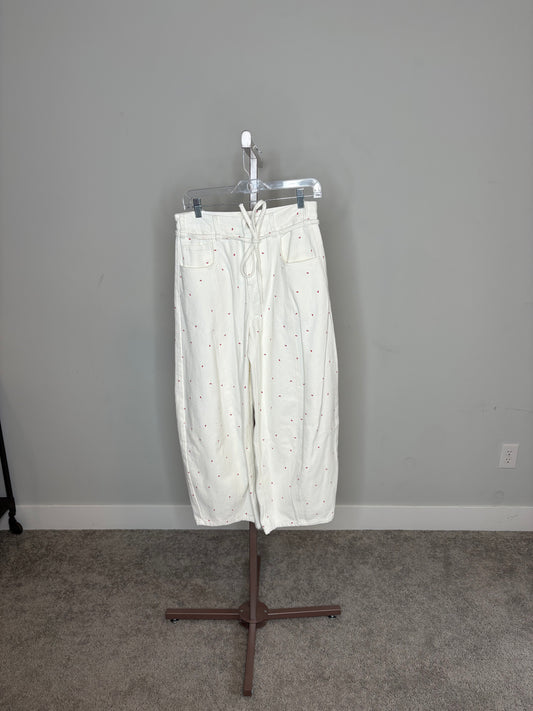 white barrel jeans with red bows