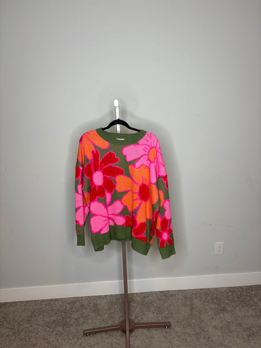 green sweater with orange and pink flowers